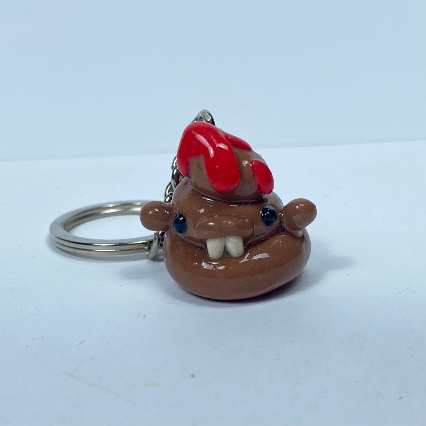 Caca estreñida | Llavero