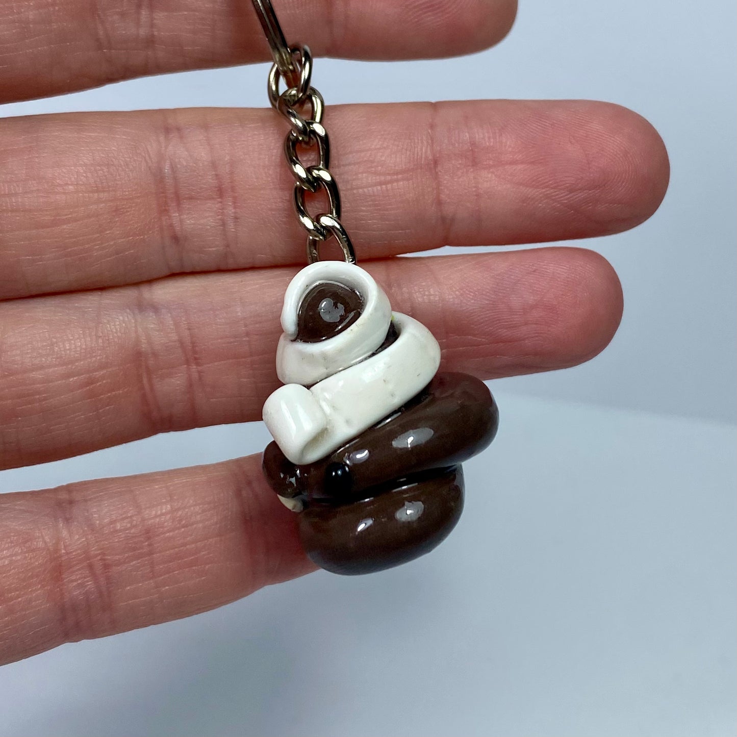 Caca enredada | Llavero